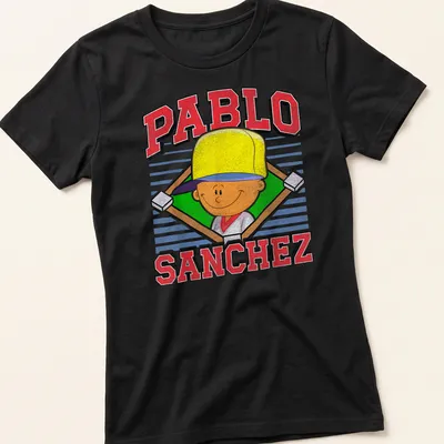 Cartoon graphic of Pablo Sanchez with vibrant text in yellow, red, green, and blue — printed on a women's shirt
