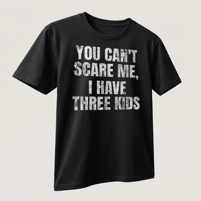 Vintage distressed tee with humorous text about parenting three kids — printed on a unisex t-shirt (angled view)