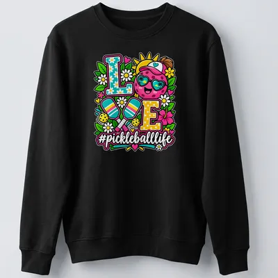 Colorful illustration of a smiling pickleball with sunglasses and text '#pickleballlife' — printed on a unisex sweatshirt