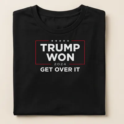 Bold political statement t-shirt with text: Trump Won Get Over It in red, white, and blue — printed on a women's shirt