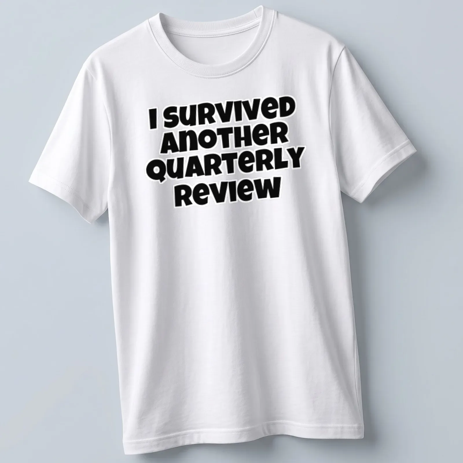 Bold black text says I Survived Another Quarterly Review on a — printed on a unisex t-shirt