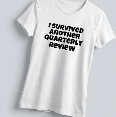 Bold black text says I Survived Another Quarterly Review on a — printed on a women's shirt