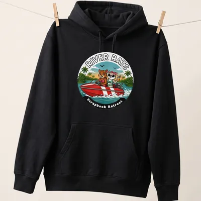 Colorful cartoon of two animals in a speedboat with scrapbook text — printed on a unisex hoodie
