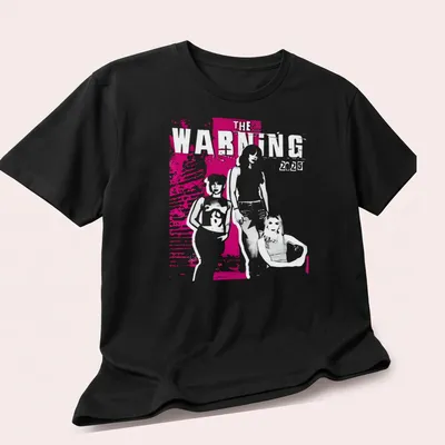 Graphic illustration t-shirt featuring The Warning 2025 text in pink, white, and black — printed on a unisex t-shirt (angled view)