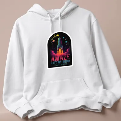 Vibrant cosmic print featuring a rocket and bold text — printed on a unisex hoodie