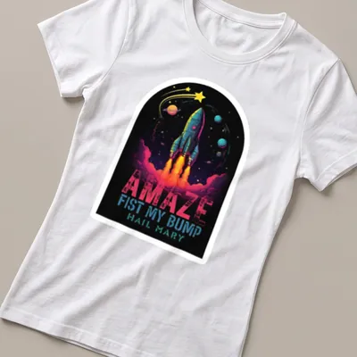 Vibrant cosmic print featuring a rocket and bold text — printed on a women's shirt