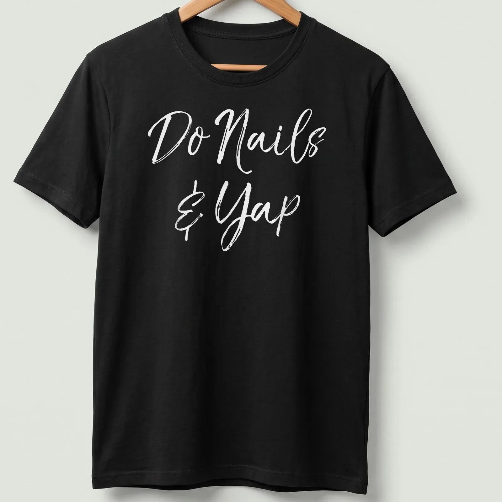 Handwritten script t-shirt featuring 'Do Nails & Yap' for beauticians — printed on a unisex t-shirt