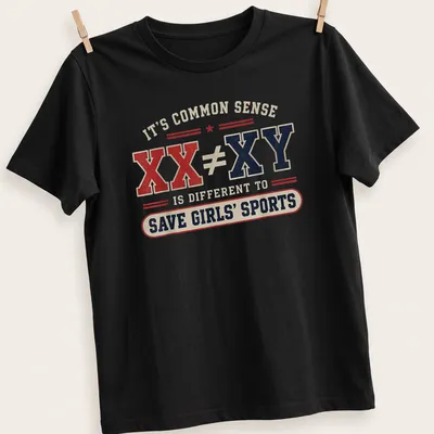 Vintage distressed t-shirt with bold text on the importance of girls' sports