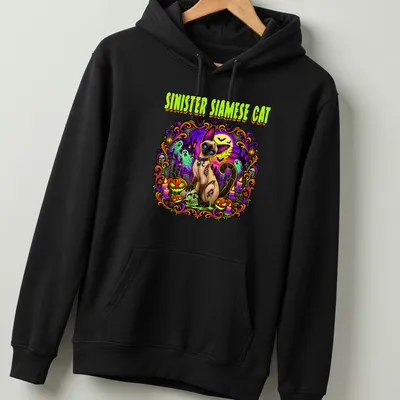 Vibrant spooky graphic of a Siamese cat with Halloween motifs in purple, green, orange, and black — printed on a unisex hoodie