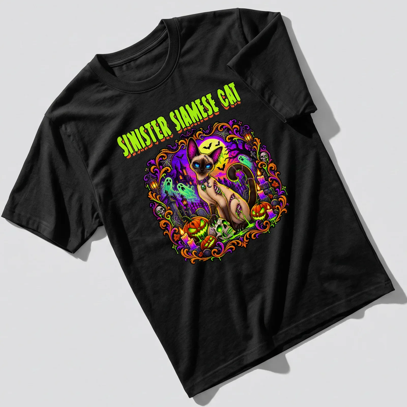 Vibrant spooky graphic of a Siamese cat with Halloween motifs in purple, green, orange, and black — printed on a unisex t-shirt