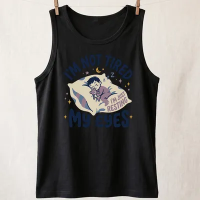 Kawaii illustration of a sleepy boy with a teddy bear and playful text — printed on a tank top