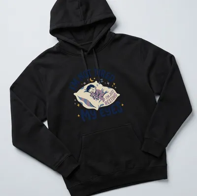Kawaii illustration of a sleepy boy with a teddy bear and playful text — printed on a unisex hoodie