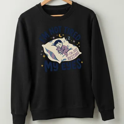 Kawaii illustration of a sleepy boy with a teddy bear and playful text — printed on a unisex sweatshirt