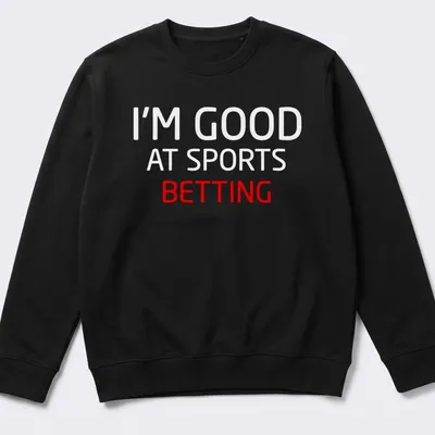 Bold typography t-shirt with the text I'm Good At Sports Betting in red and white — printed on a unisex sweatshirt