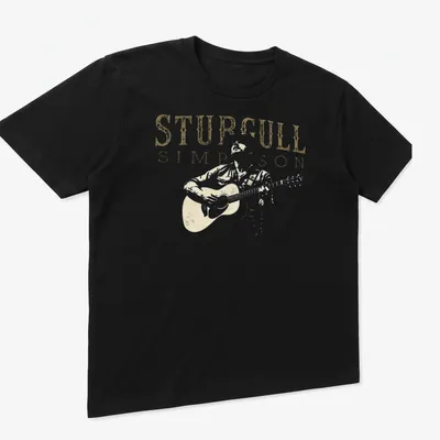 Vintage graphic of Sturgill Simpson playing guitar with distressed text — printed on a unisex t-shirt (angled view)