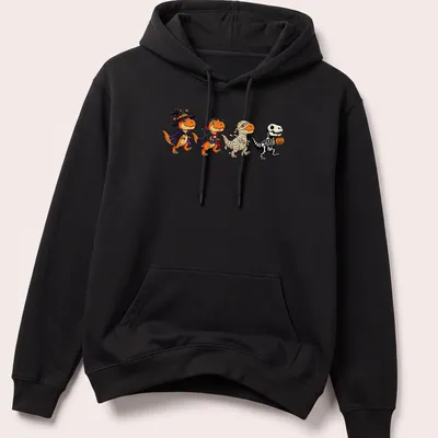 Kawaii T Rex dressed as a witch and vampire for Halloween in orange, black, purple, and white — printed on a unisex hoodie