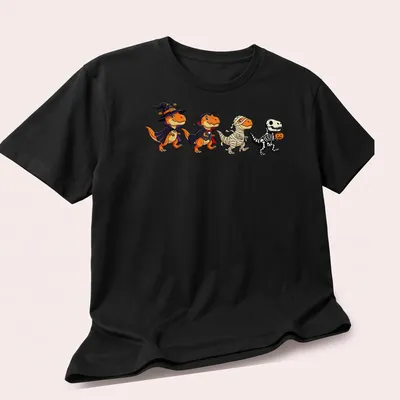Kawaii T Rex dressed as a witch and vampire for Halloween in orange, black, purple, and white — printed on a unisex t-shirt (angled view)