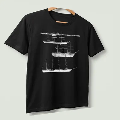 Illustration of tall ships in black and white with elegant script text — printed on a unisex t-shirt (angled view)
