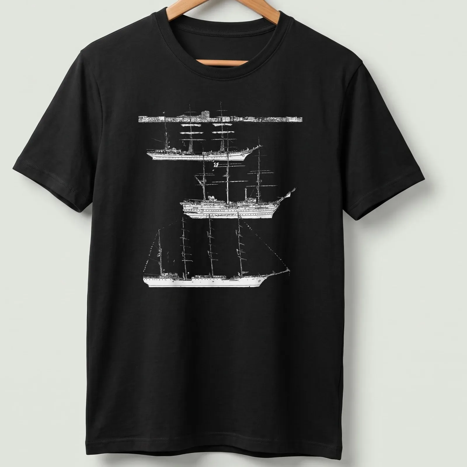 Illustration of tall ships in black and white with elegant script text — printed on a unisex t-shirt