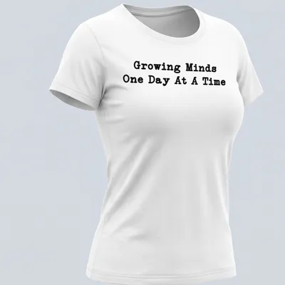 Bold typography Teacher shirt with the phrase Growing Minds One Day At A Time in black — printed on a women's shirt