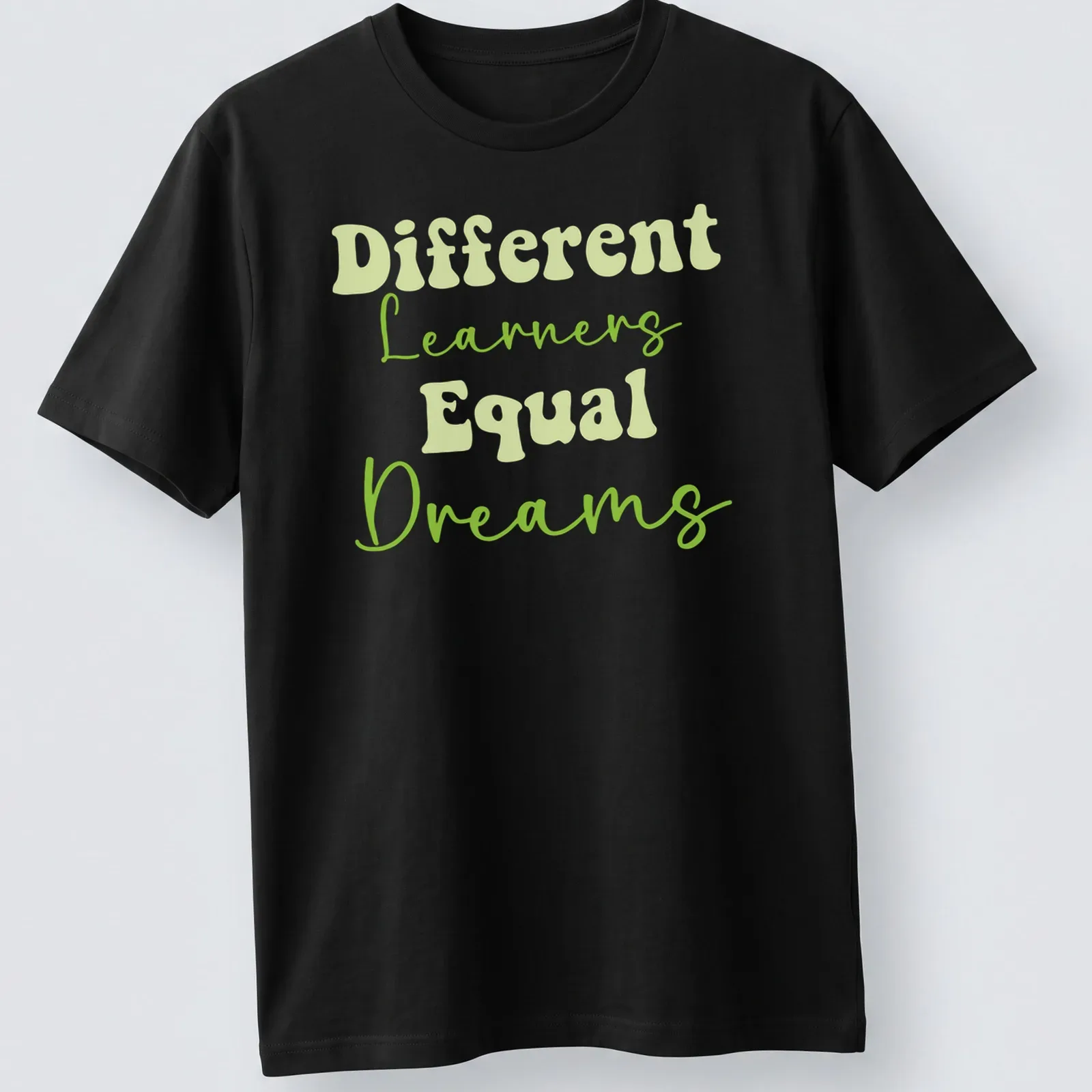 Playful script t-shirt with 'Different Learners Equal Dreams' for teachers — printed on a unisex t-shirt