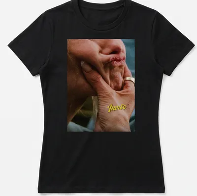Photographic tee featuring a hand holding a thoughtful face with text "The Invite" above. — printed on a women's shirt