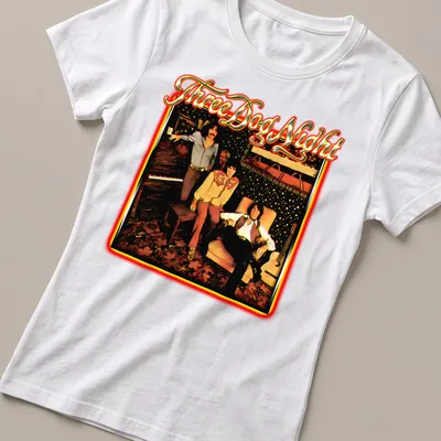 Retro design of the Three Dog Night band in black, red, gold, and white — printed on a women's shirt