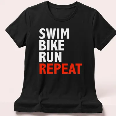 Bold typography t-shirt featuring the word REPEAT, representing triathlon training. — printed on a women's shirt