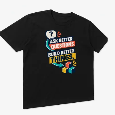Colorful building blocks surrounding the text 'Ask Better Questions. Build Better Things.' — printed on a unisex t-shirt (angled view)