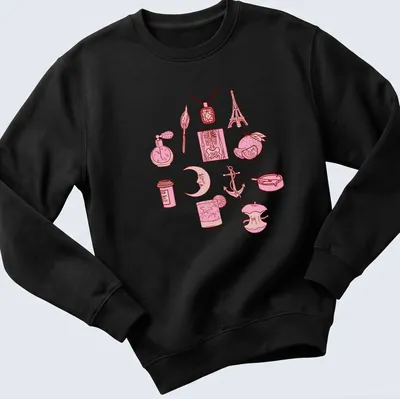 Line-art design featuring various illustrations and the quote about love — printed on a unisex sweatshirt