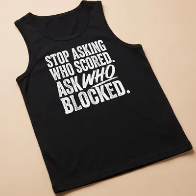 Bold typography t-shirt featuring volleyball humor about blocking and scoring — printed on a tank top