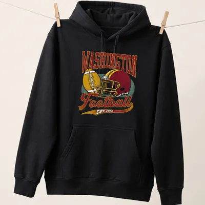 Retro Washington Football t-shirt featuring EST. 1932 text and football graphics — printed on a unisex hoodie