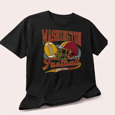 Retro Washington Football t-shirt featuring EST. 1932 text and football graphics — printed on a unisex t-shirt (angled view)