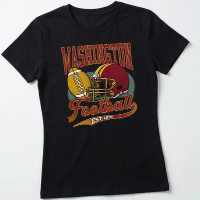 Retro Washington Football t-shirt featuring EST. 1932 text and football graphics — printed on a women's shirt
