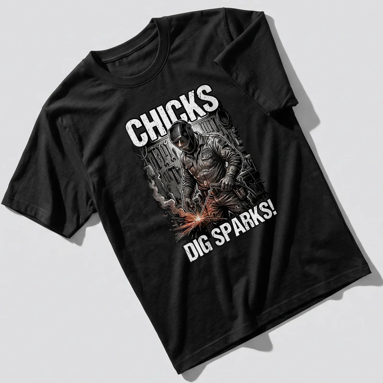 Vintage illustration of a welder with text 'Chicks Dig Sparks!' in black, white, orange, and gray — printed on a unisex t-shirt