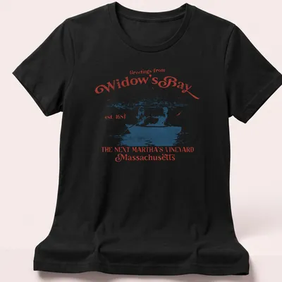 Vintage postcard style t-shirt with a rowboat scene and greetings text — printed on a women's shirt