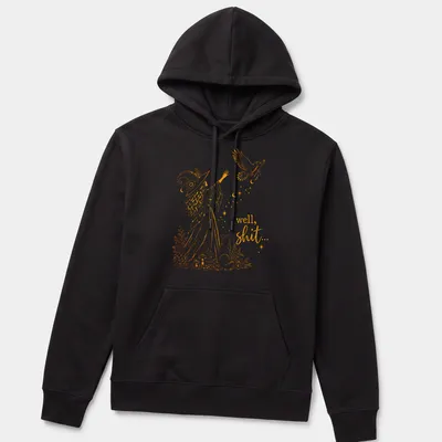 Illustrative line-art of a witch with a crow and a magic wand alongside the text 'well, shit...' — printed on a unisex hoodie