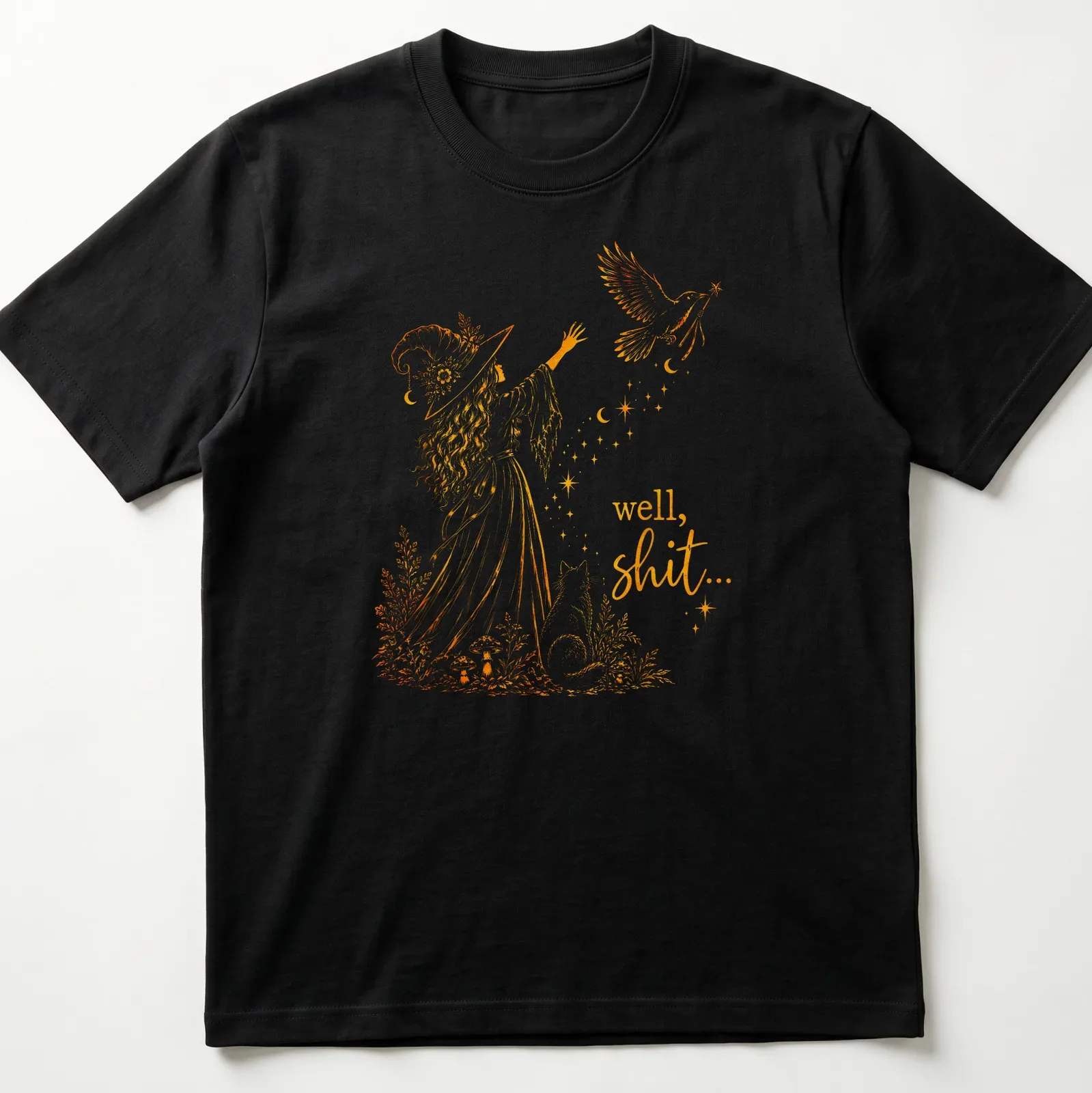 Illustrative line-art of a witch with a crow and a magic wand alongside the text 'well, shit...' — printed on a unisex t-shirt