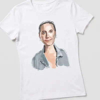 Watercolor illustration of a woman with rectangular earrings in soft colors — printed on a women's shirt