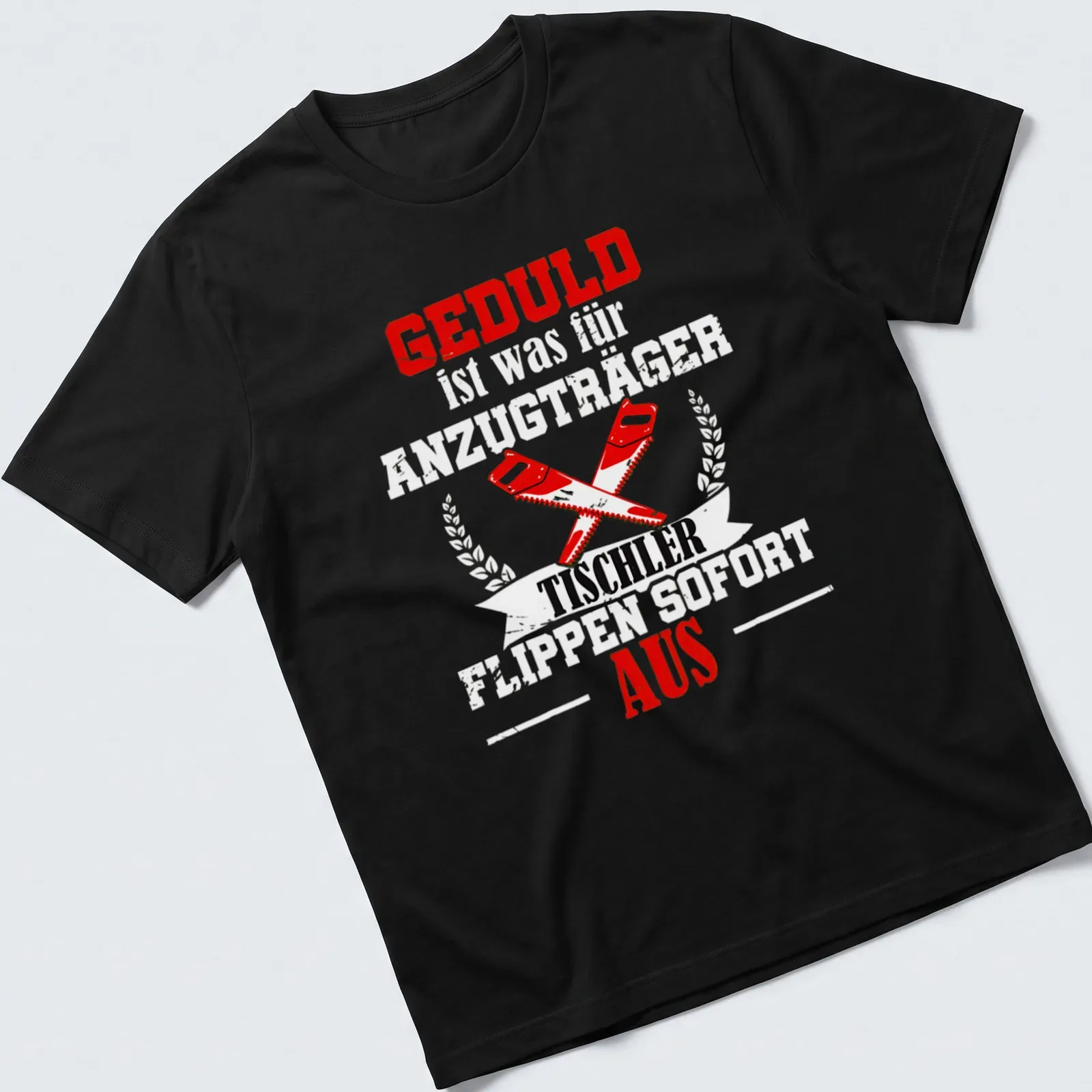Bold graphic t-shirt featuring crossed saws and GEDULD TISCHLER AUS text — printed on a unisex t-shirt