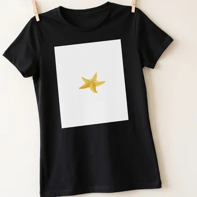 Simple illustration of a yellow starfish on a white background — printed on a women's shirt